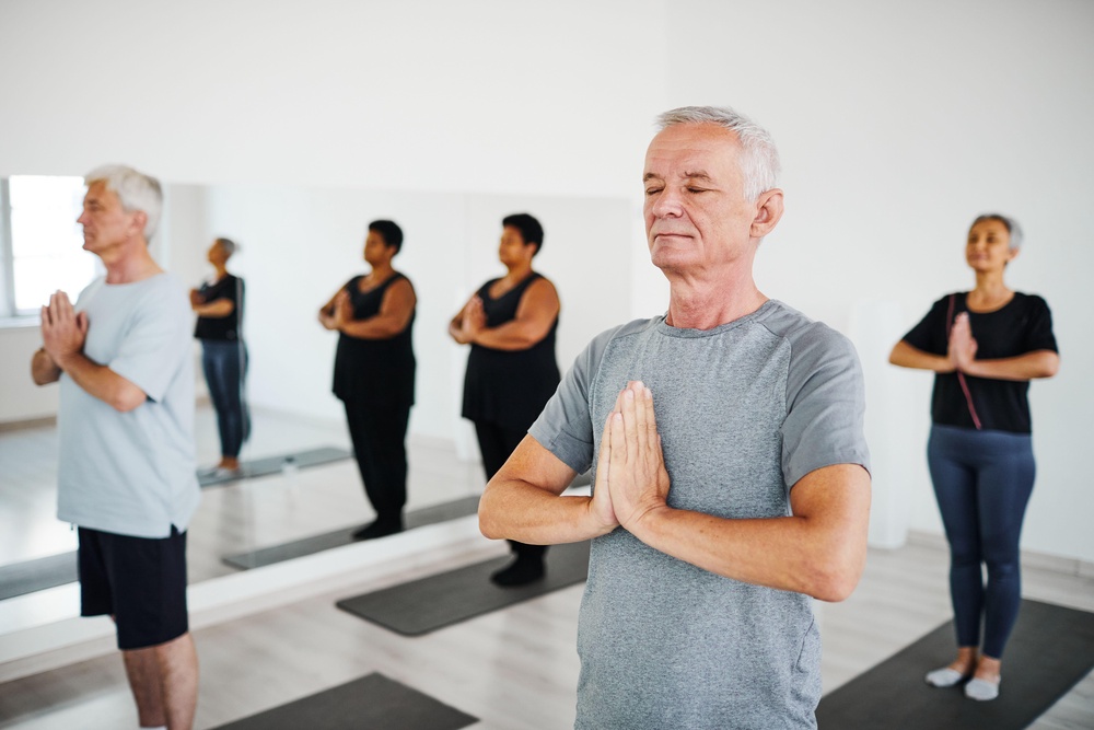 Yoga can be adjusted to suit different abilities (Alamy/PA)