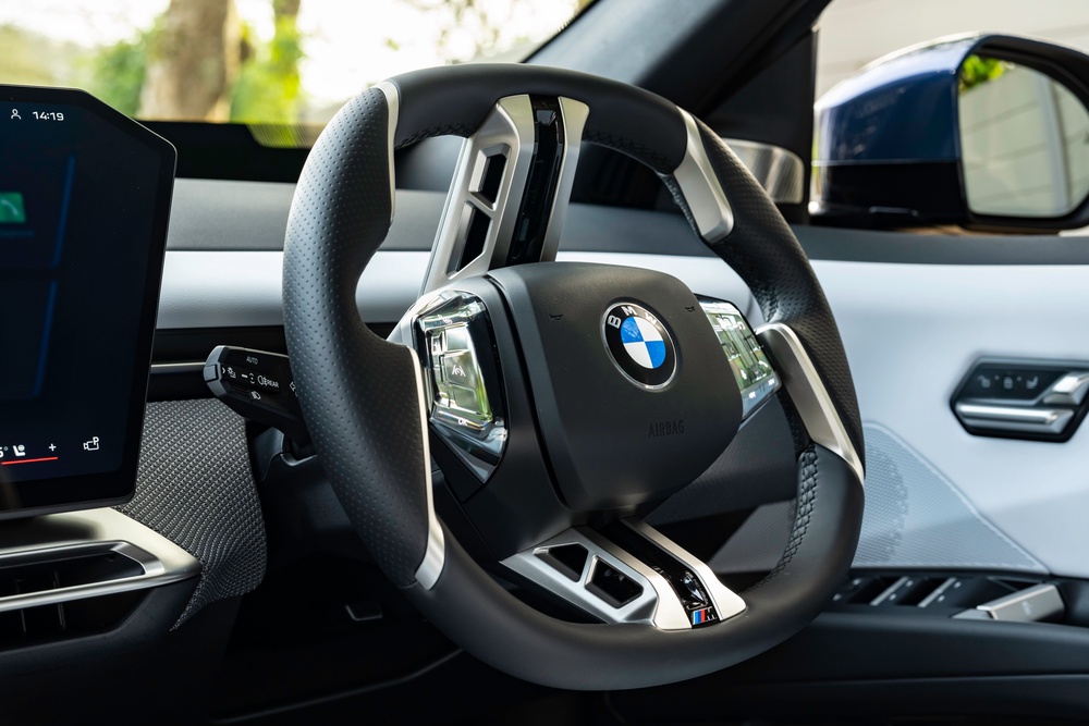 The iDrive controls on the BMW iX3's steering wheel can be tricky to use and could see you call someone when you're trying to change a music track (BMW)