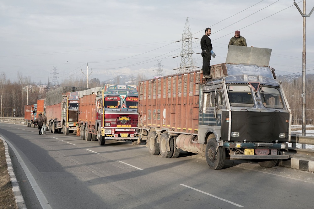Trucks halted at Qazigund following the traffic regulations on Jammu-Srinagar National Highway (Mir Musavir Shabir)