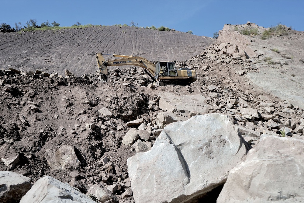 A bulldozer clearing landslide debris on National Highway 44 (Mir Musavir Shabir)