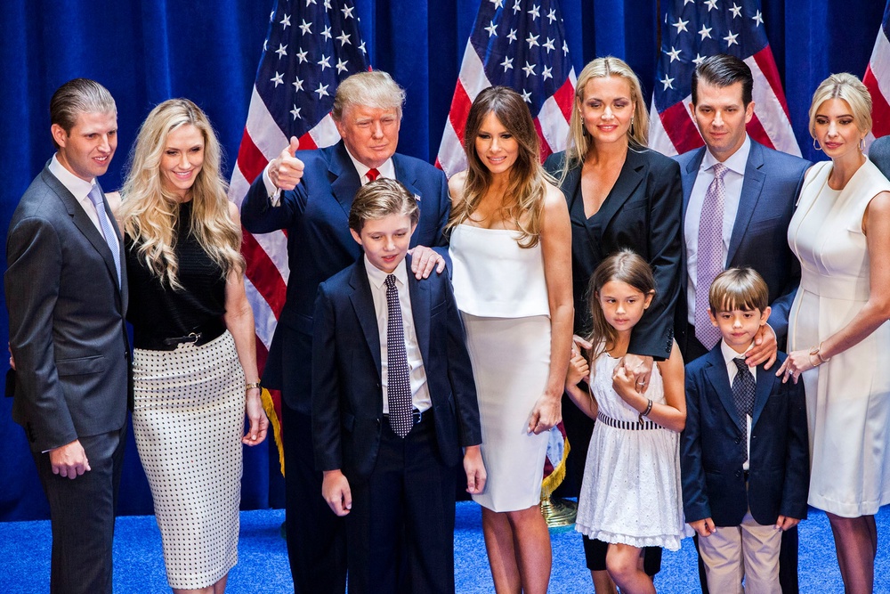 (L-R) Eric Trump, Lara Yunaska Trump, Donald Trump, Barron Trump, Melania Trump, Vanessa Haydon Trump, Kai Madison Trump, Donald Trump Jr., Donald John Trump III, and Ivanka Trump pose for photos on stage after Donald Trump announced his candidacy for the U.S. presidency at Trump Tower on June 16, 2015 in New York City (Getty)