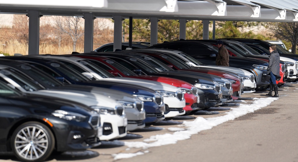 Unsold 2023 and 2024 models sit on display outside a BMW dealership (AP)
