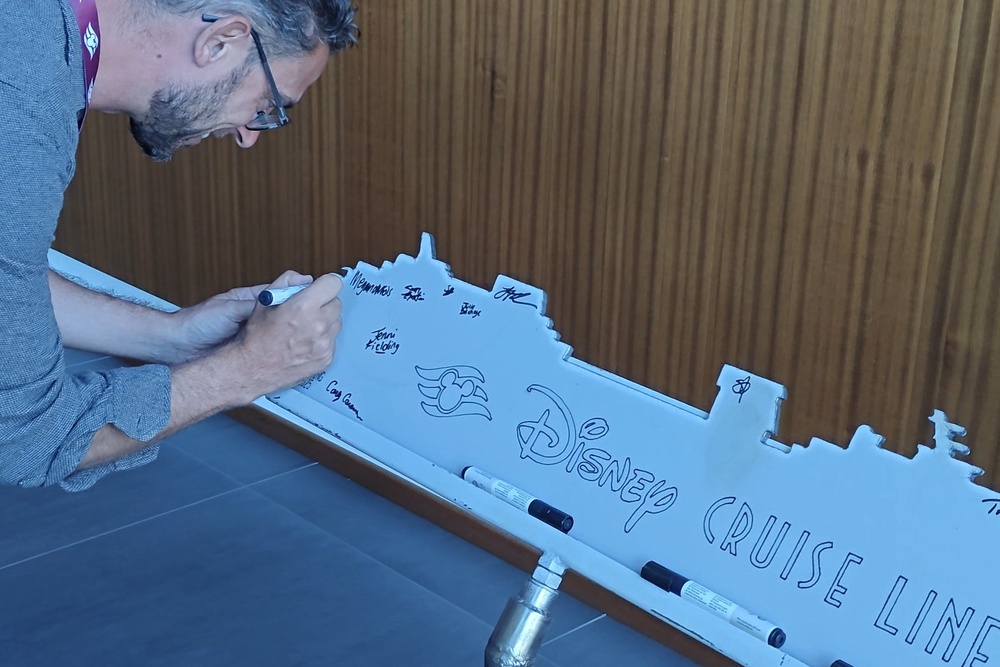 Cruise editor Marc Shoffman signed the first steel cutting of Disney Believe in August 2025 (Marc Shoffman)