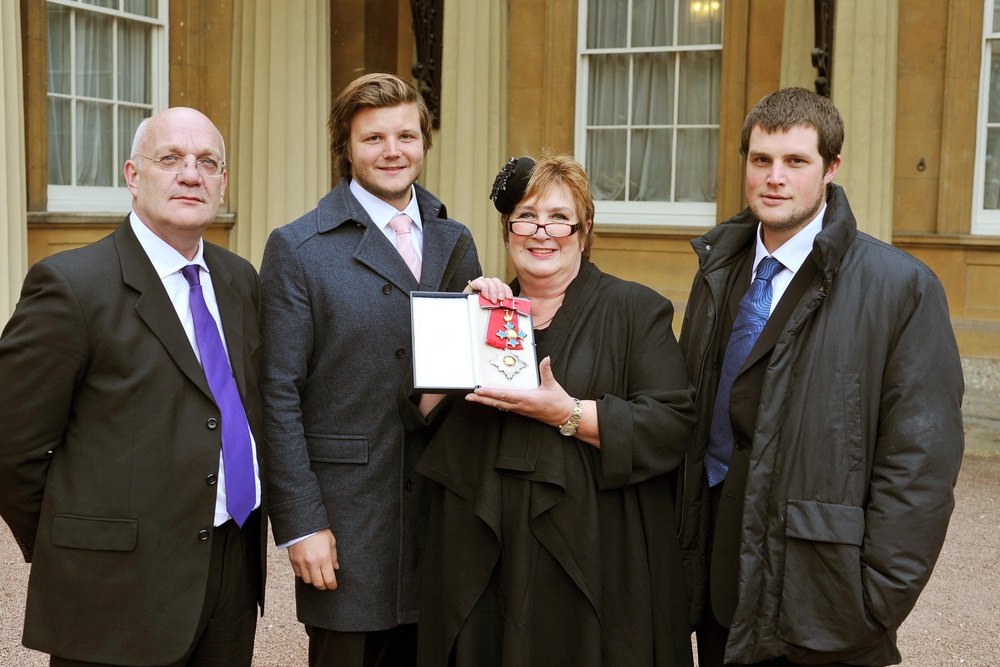 Dame Jenni Murray in 2011 with (from left) her husband David and sons Charlie and Ed (PA Archive)