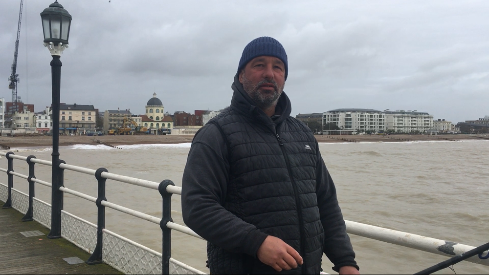 Lou, fishing on Worthing Pier, claims most people in Worthing will be happy if Labour and the Greens don’t triumph (Harry Cockburn/The Independent)