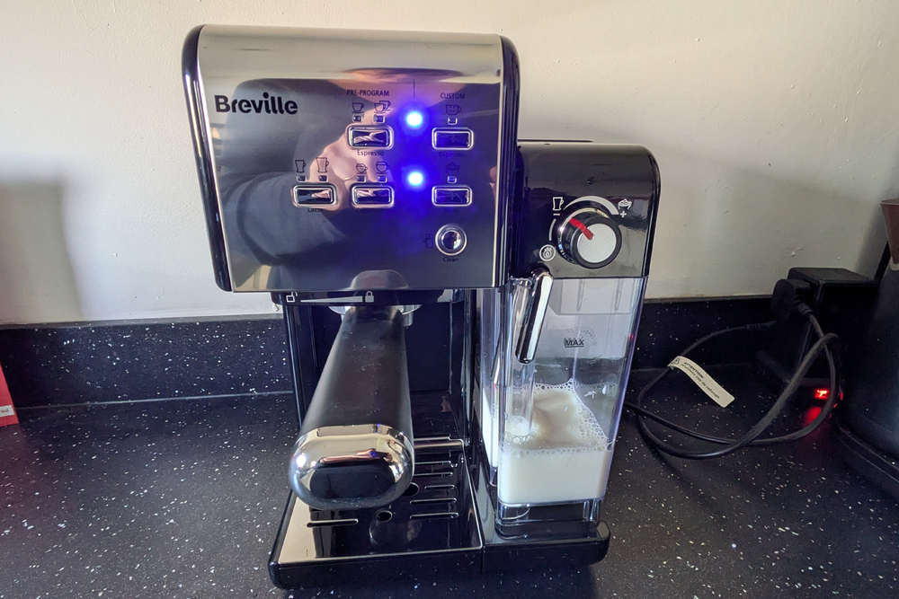 Milk frothing and coffee making is done in one (Rachael Penn/The Independent)