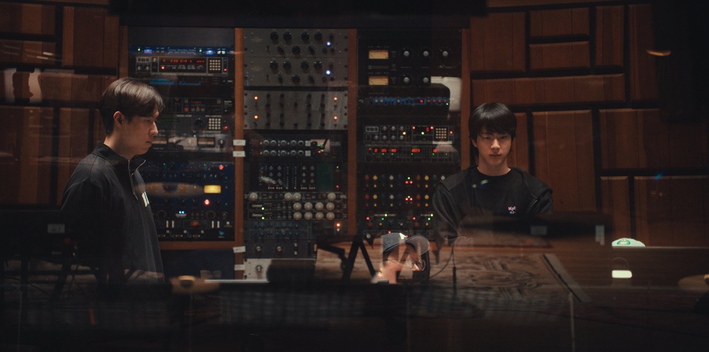 Jin (right) joins the rest of BTS  in Los Angeles a day after his tour ended (COURTESY OF NETFLIX)