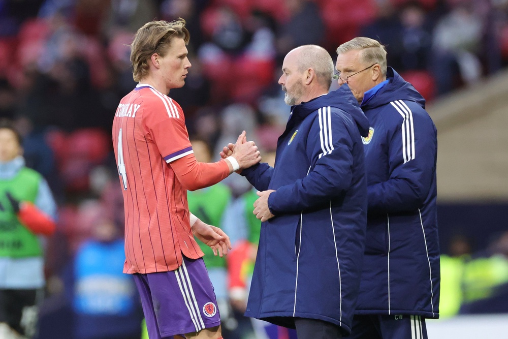 Scotland coach Steve Clarke (centre) with midfielder Scott McTominay (PA)