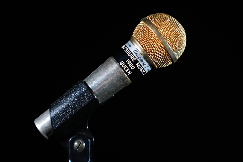The gold microphone presented to Freddie Mercury in 1980, set to fetch between  £30,000 and £60,000 at auction. (PA)