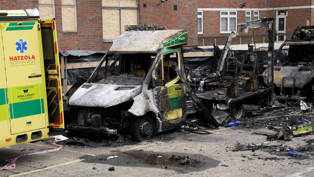 The burnt-out remains of Hatzola ambulances at the Jewish Community Ambulance service in Golders Green in March (PA)