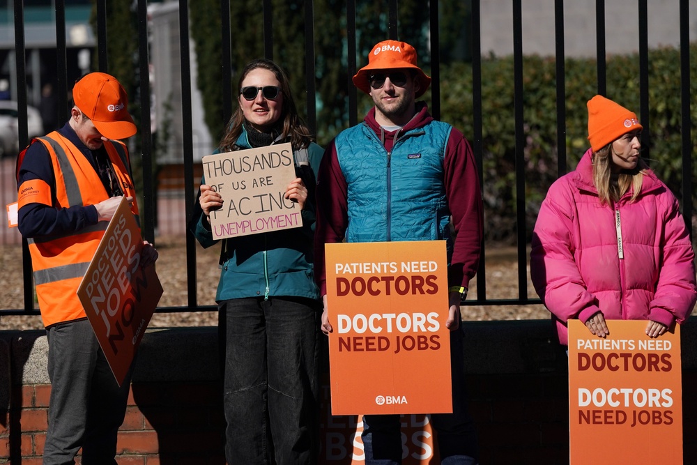 Resident doctors hold placards outside the Royal Victoria Infirmary in Newcastle on the first day of a planned six-day strike on April 7 (Getty)