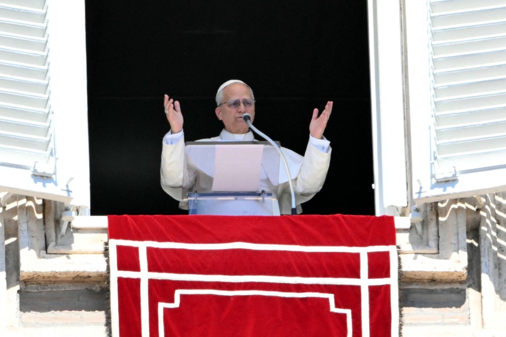 Pope Leo XIV addresses the crowd from the window of the apostolic palace on 6 April, amid concern over the war in the Gulf (AFP/Getty)