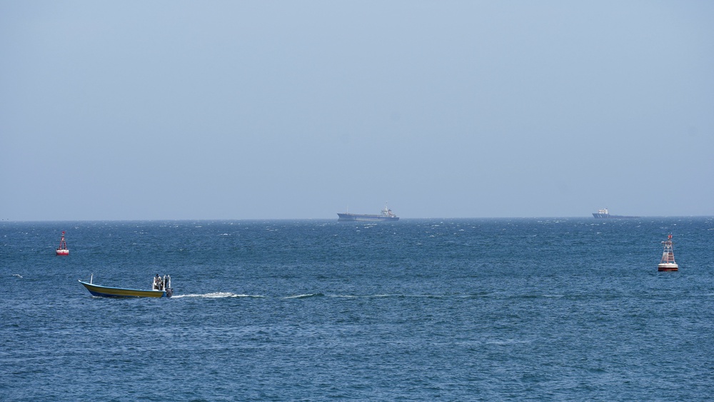 Vessels and boats pictured in the Strait of Hormuz off the coast of Oman (Reuters)
