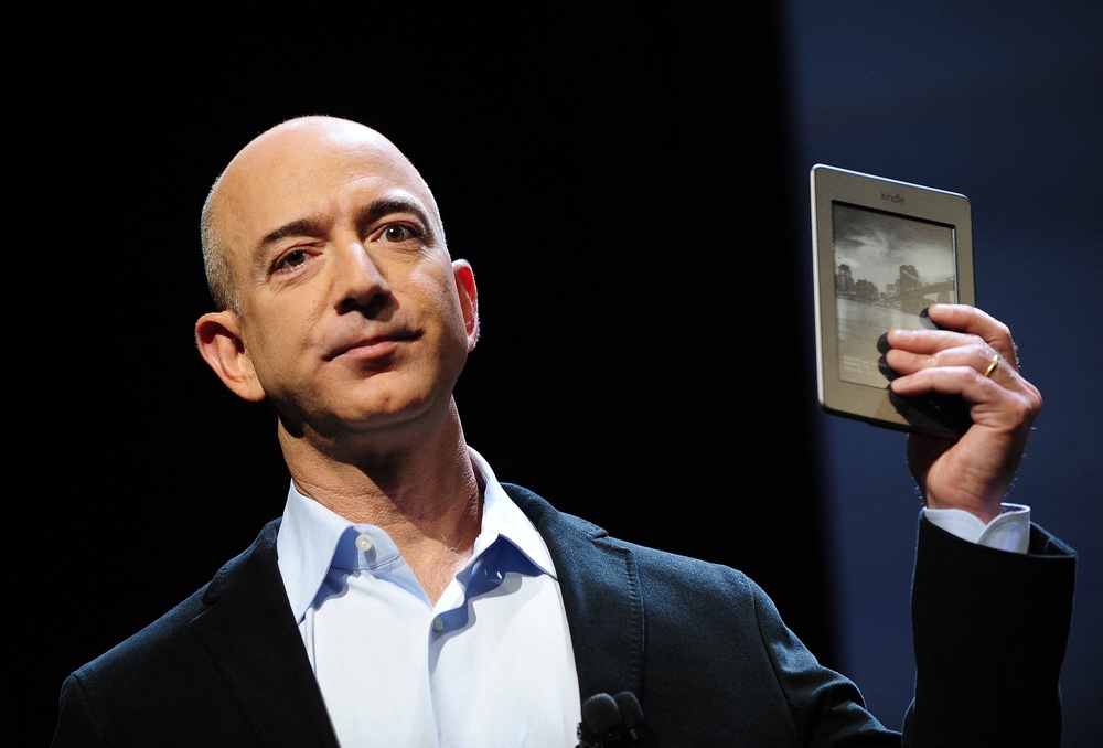 Amazon CEO Jeff Bezos pictured with the Kindle Touch in 2011. The Kindle Touch is one of the devices that will no longer be supported by Amazon starting in May (AFP via Getty Images)