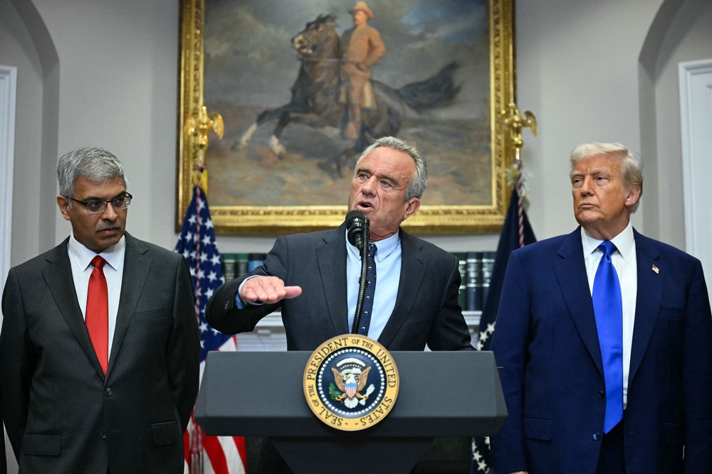 Acting CDC director Jay Bhattacharya, appearing alongside Health Secretary Robert F Kennedy Jr and President Donald Trump, raised concerns about the methodology used in the study, delaying its publication in March (AFP/Getty)