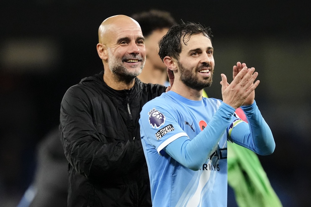 Bernardo Silva (right) with Manchester City manager Pep Guardiola (Nck Potts/PA) (PA Wire)