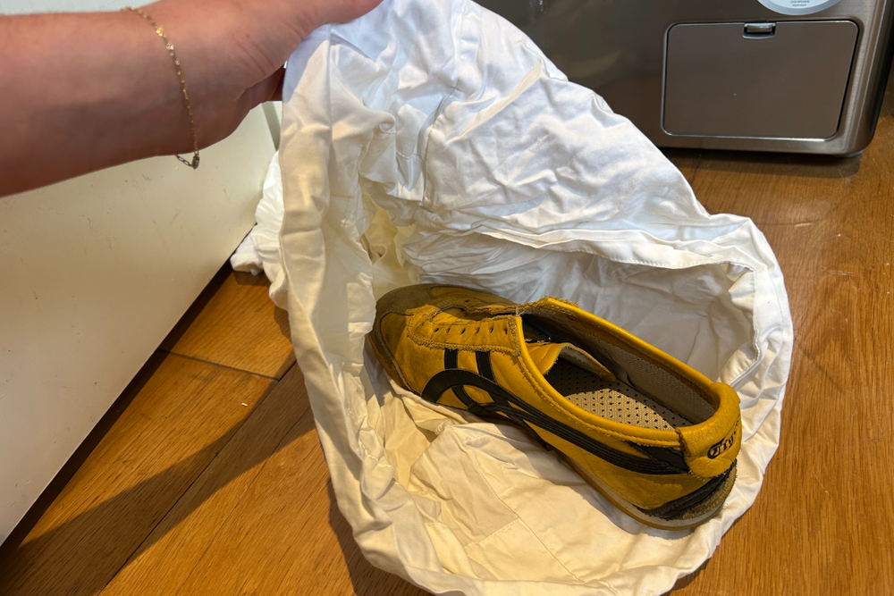 Use an old pillowcase to protect your trainers – and always remove the laces first (Daisy Lester/The Independent)