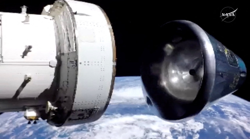 The Artemis II crew module separates from its service module as it prepares for re-entry to Earth following the Artemis II crew's flyby of the Moon, 10 April, 2026 (via REUTERS)