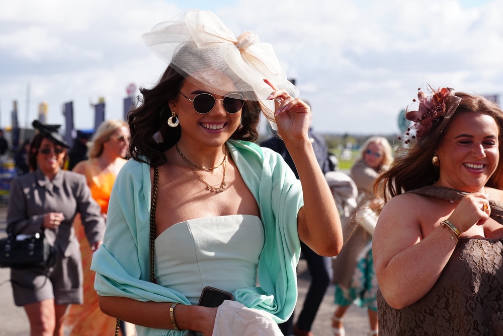 Racegoers at Aintree (Owen Humphreys/PA) (PA Wire)