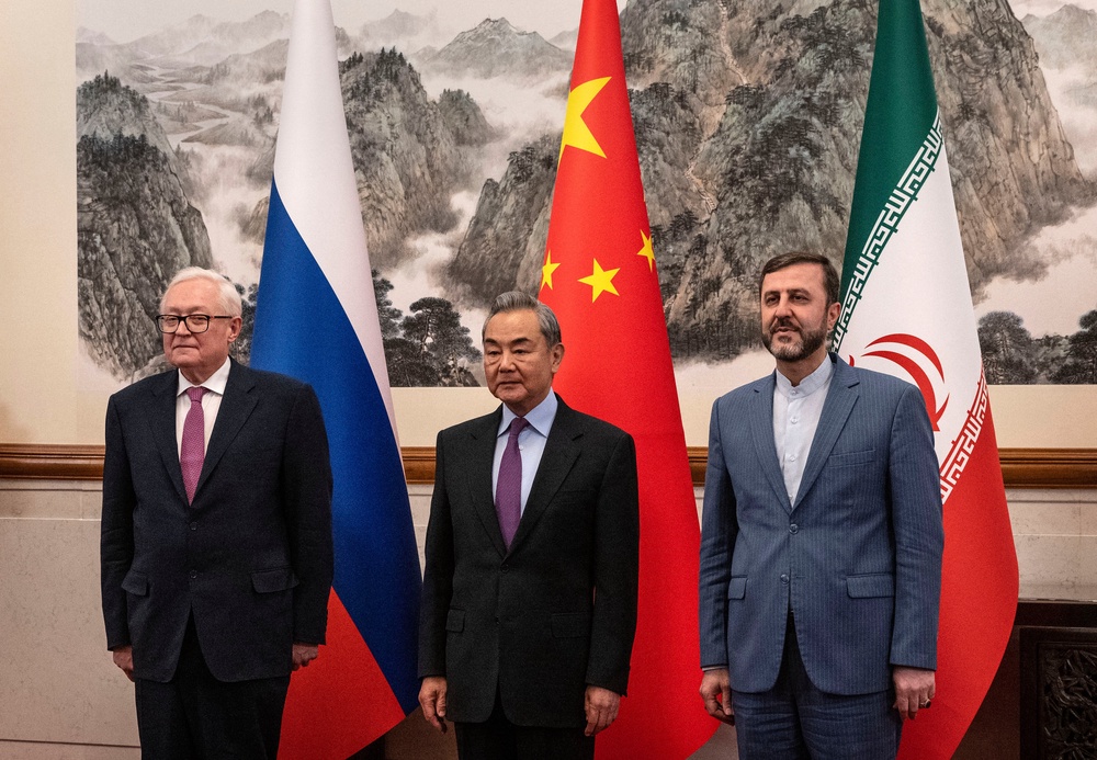 Last year, China's foreign minister met with Russia's and Iran's deputy foreign ministers to discuss sanctions relief on Iran (POOL/AFP via Getty Images)