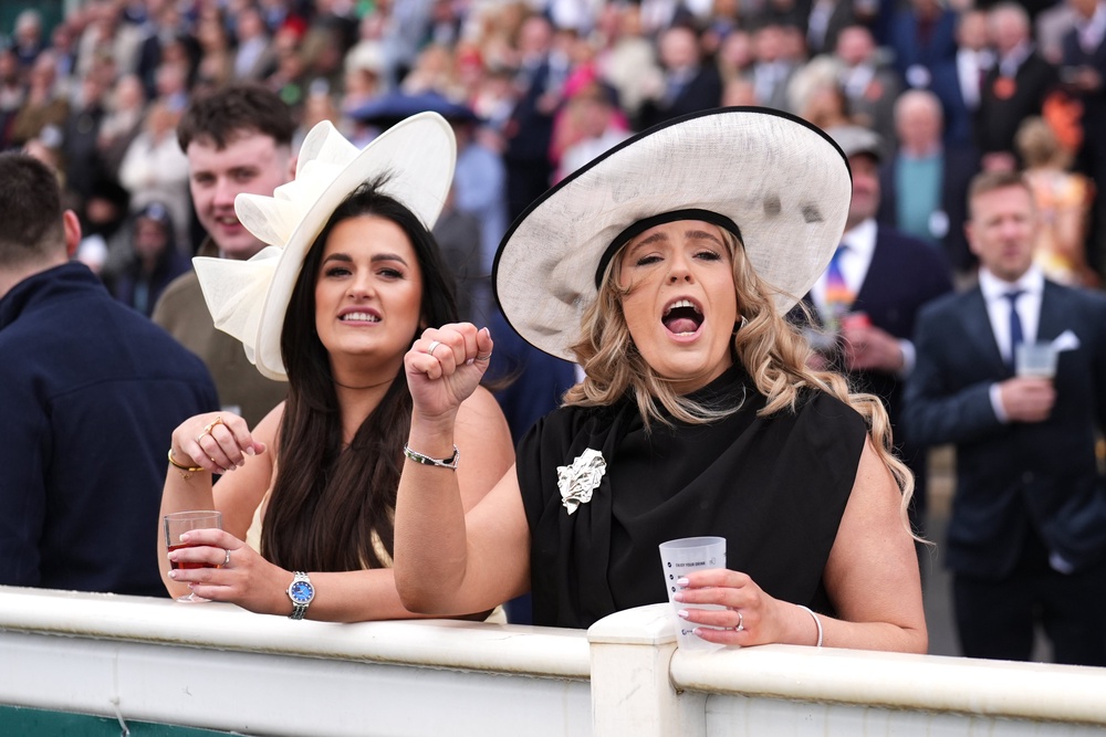Racegoers react during the William Hill Handicap Chase on Grand National Day at Aintree Racecourse (Mike Egerton/PA) (PA Wire)