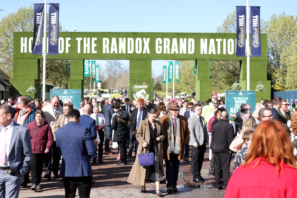 Racegoers arrive on day three of the Randox Grand National Festival (Matt Alexander for The Jockey Club/PA) (PA Wire)