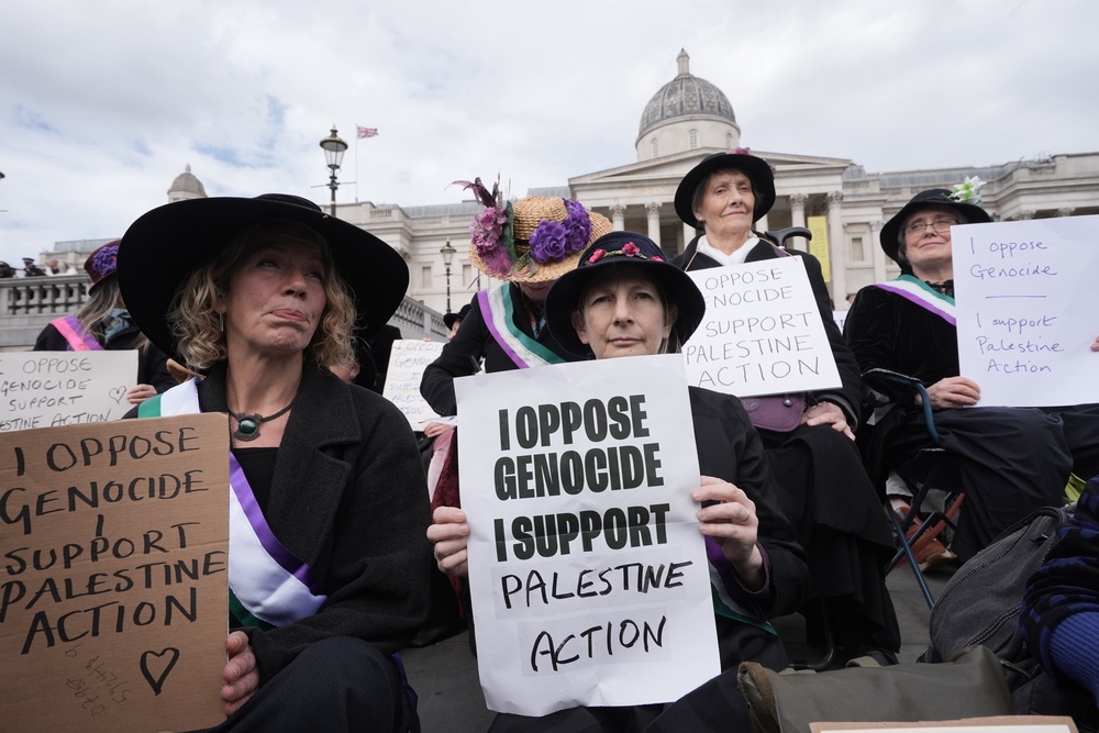 Protesters hold up placards at a demonstration against the ban on Palestine Action in Trafalgar Square, central London (Stefan Rousseau/PA) (PA Wire)