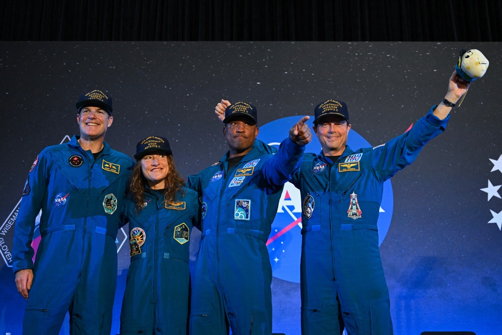 NASA's Artemis II mission astronauts Canadian Space Agency's Jeremy Hansen, Christina Koch, Victor Glover and commander Reid Wiseman react during a welcoming ceremony at Ellington Field Joint Reserve Base in Houston, Texas, on April 11, 2026 (AFP via Getty Images)