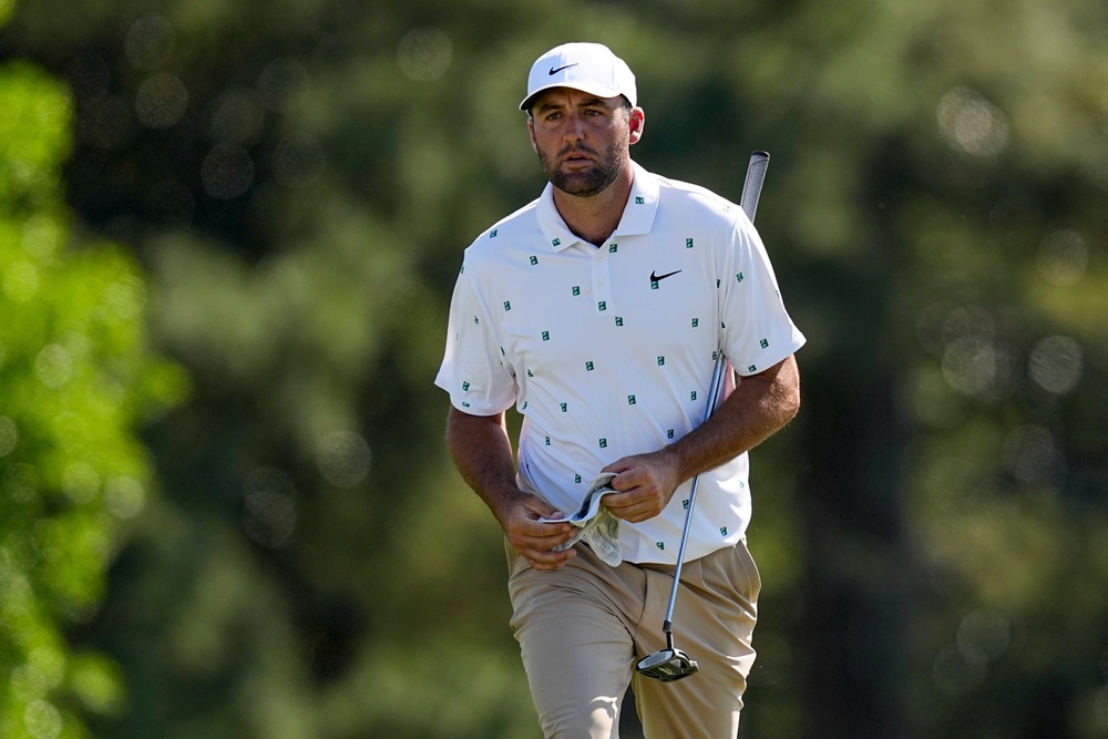 Scottie Scheffler is lurking after a blazing 65 on Saturday (AP)