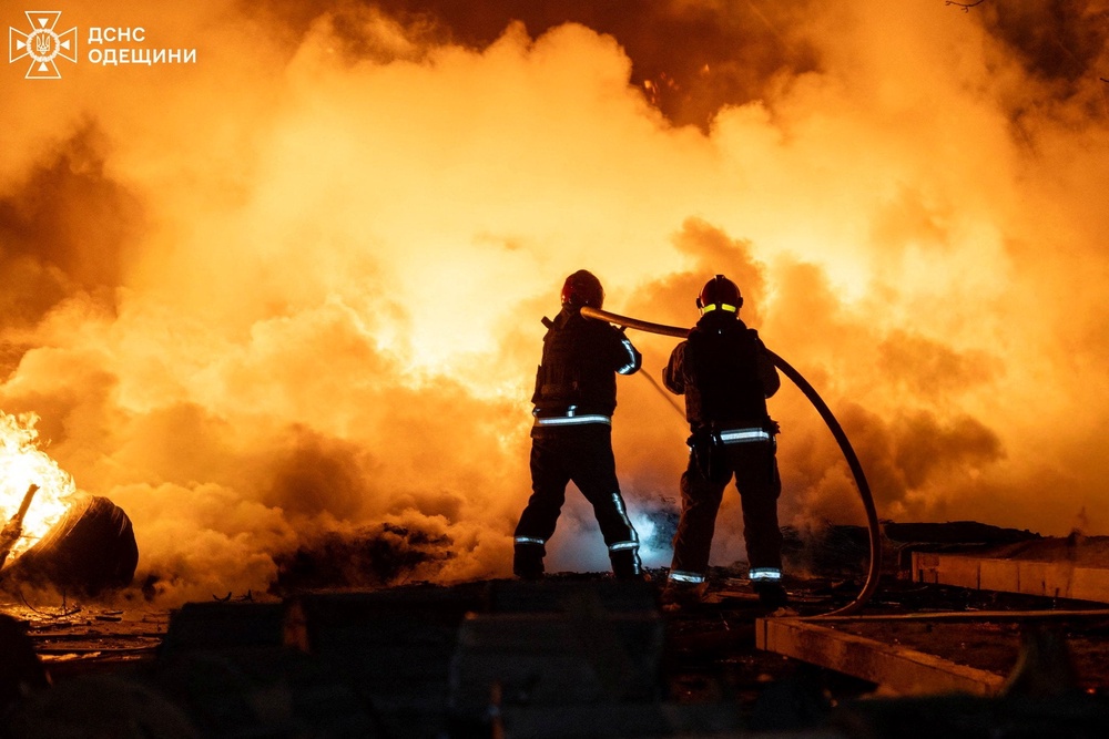 Firefighters work at the site of an overnight Russian drone strike in Odesa on Saturday (via REUTERS)