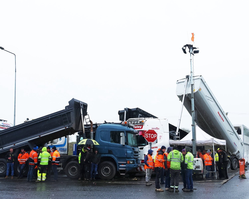 Protesters take part in a blockade at a fuel depot in Foynes, Co Limerick, on Friday