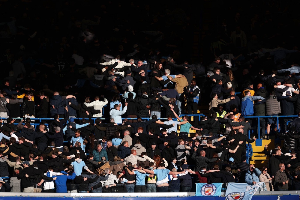 Man City fans do the ‘Poznan’ as they celebrate their side’s dominance against Chelsea (Getty Images)