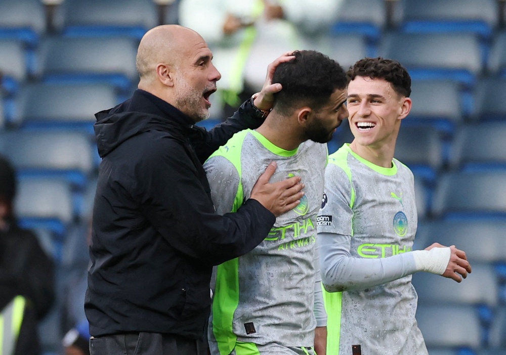 Pep Guardiola celebrates with his players at full-time (Action Images via Reuters)