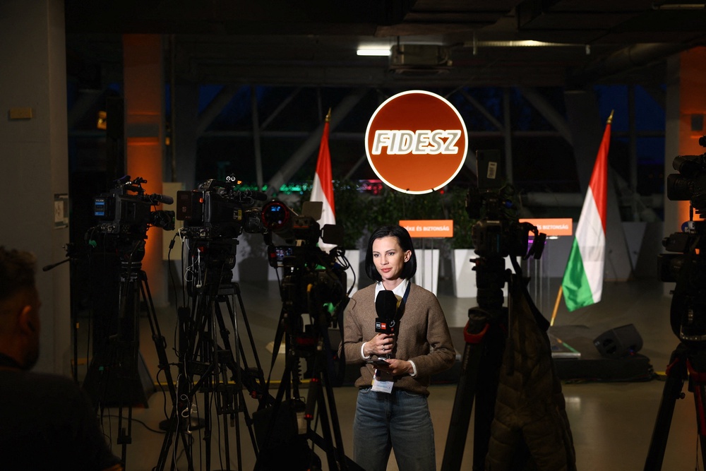 Members of the media work at the Fidesz Party headquarters on the day of the parliamentary election (REUTERS)