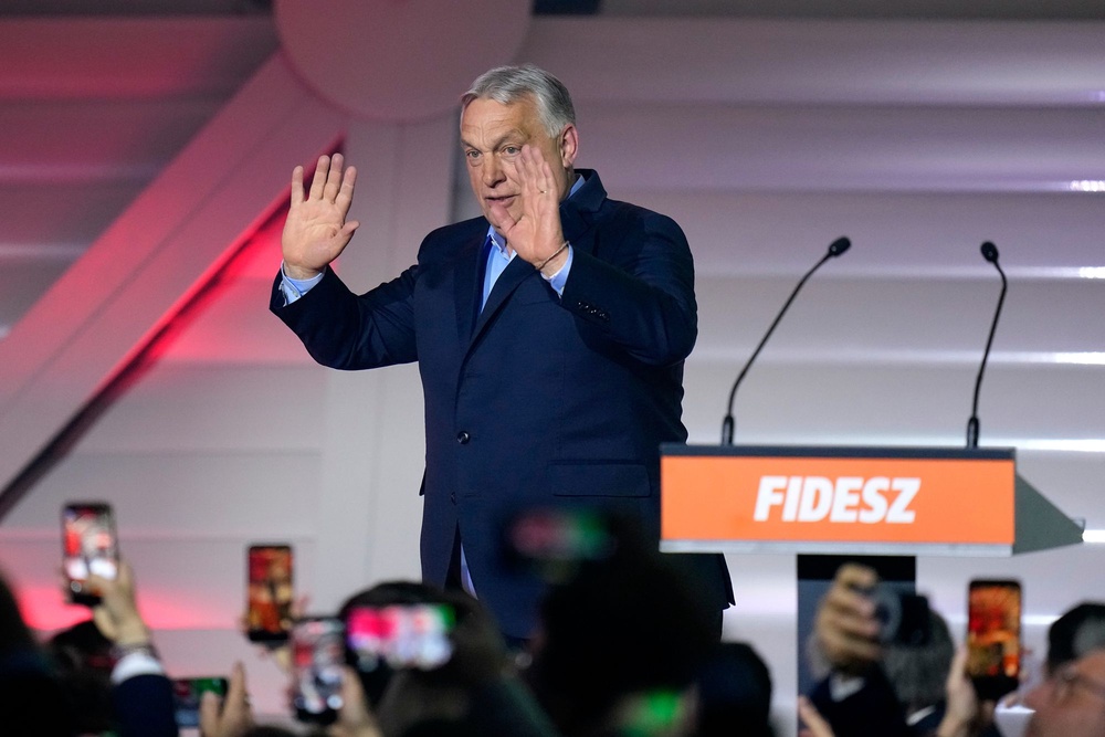 Hungary's Prime Minister Viktor Orban reacts after receiving the results of a parliamentary election in Budapest (AP)