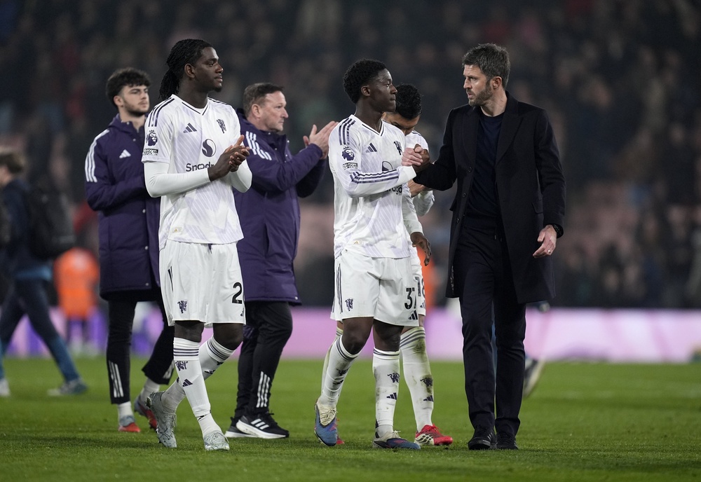 Manchester United manager Michael Carrick, right, is confident on Kobbie Mainoo’s future, centre (Adam Matthews/PA) (PA Wire)