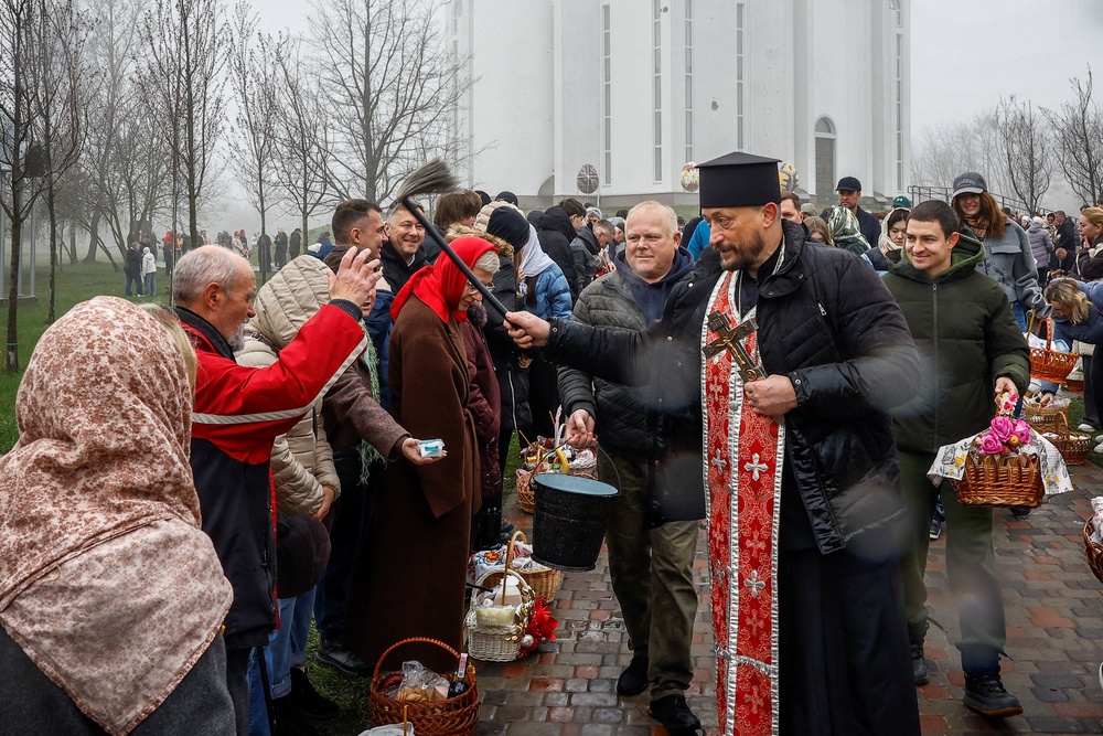 Orthodox Christians mark Easter during a ceasefire declared by Vladimir Putin, in Bucha (REUTERS)