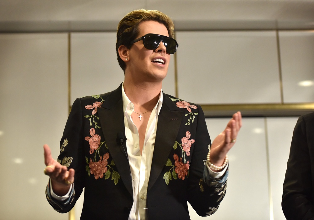Right-wing British provocateur Milo Yiannopoulos answers questions during a speech at Parliament House in Canberra, Australia, in 2017 (AFP/Getty)