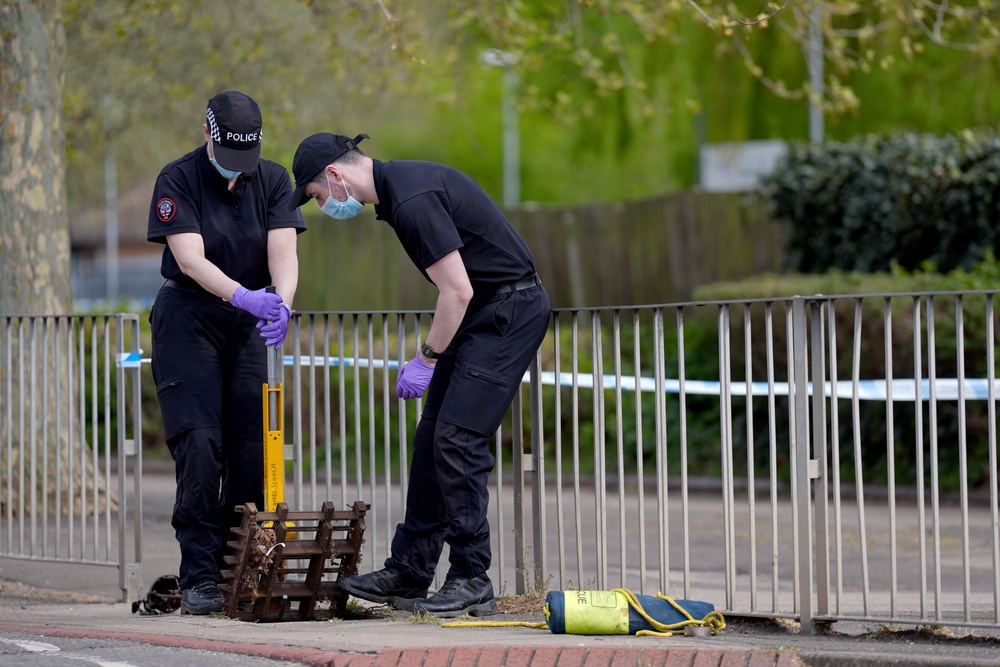 Police officers on Riseholme, near the Orton Centre shopping centre, close to where Baye Bireme Fall was stabbed to death in Peterborough (PA)