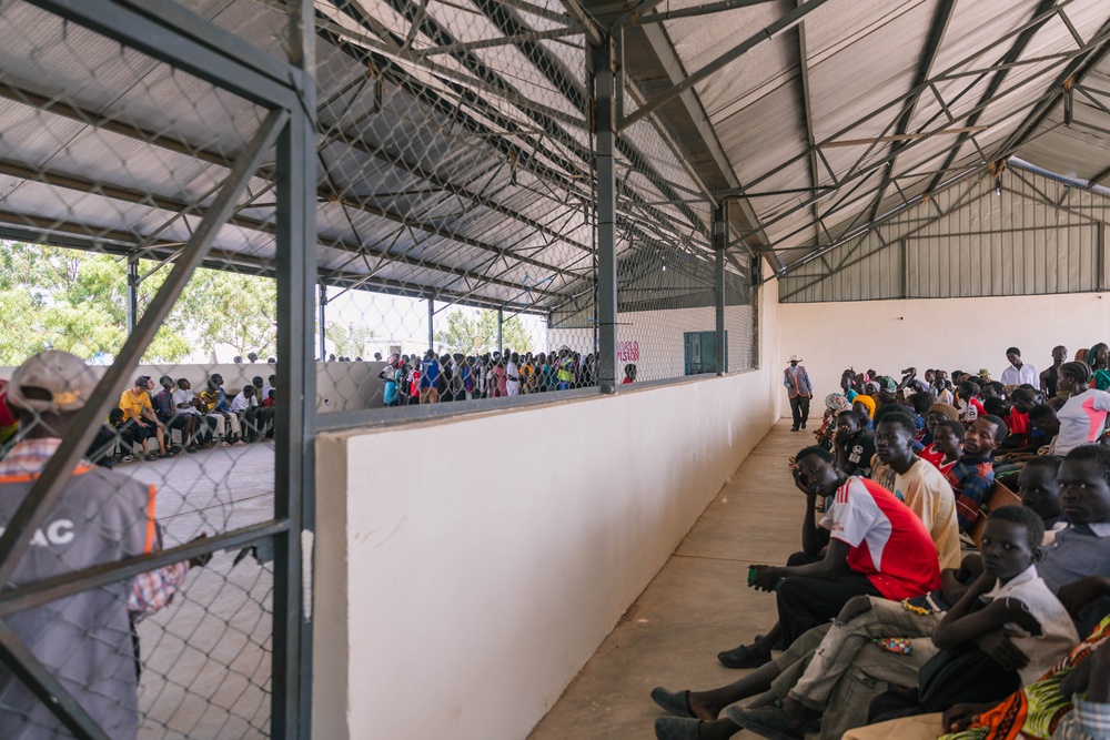 Residents of the Kalobeyei refugee settlement line up for food distribution (Sarah Waiswa/British Red Cross)