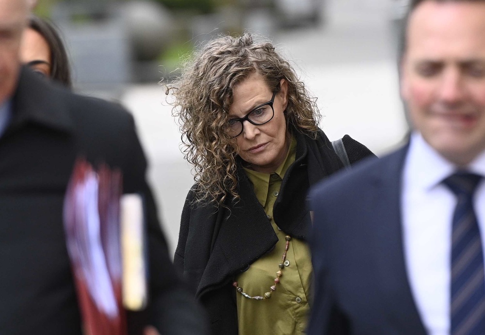 Fiona Donohoe (centre), the mother of 14-year-old Noah Donohoe, outside Belfast Coroner’s Court, for the inquest into the death of Noah, who was found dead in a storm drain in north Belfast in June 2020. (PA Wire)