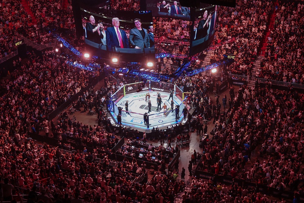 A longtime fan of the sport, Trump became the first sitting president to attend a UFC event in 2019. He is seen sitting ring-side at a fight in Miami Saturday (Getty Images)