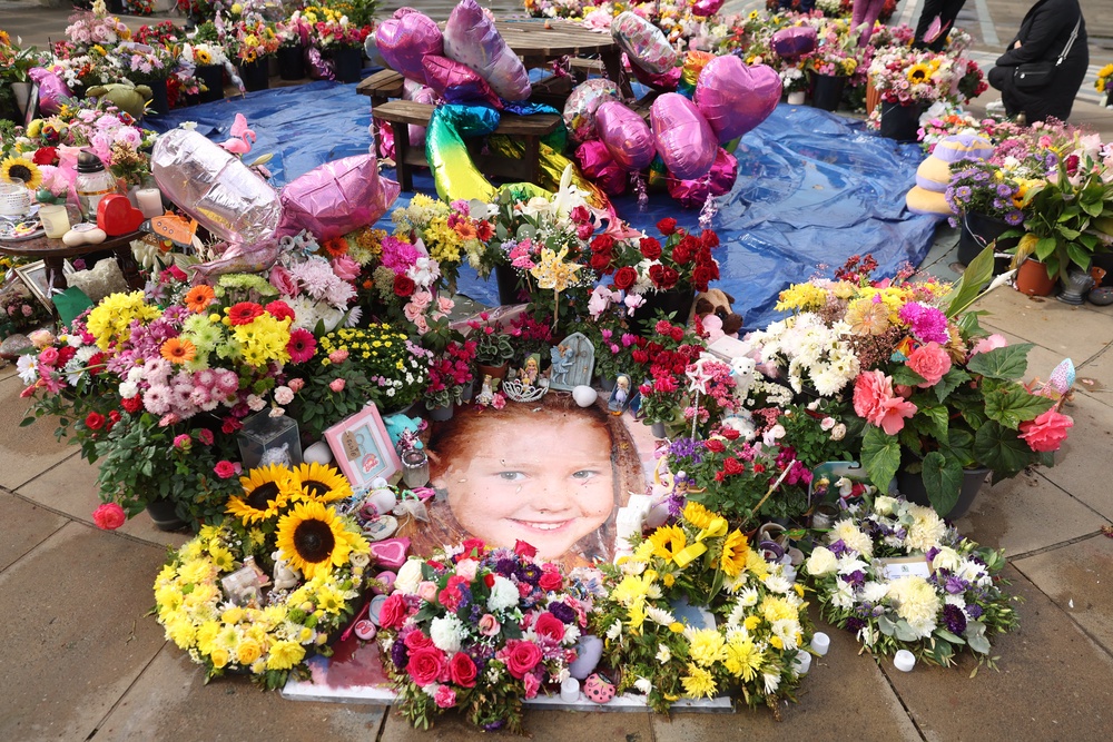 A photo of Elsie Dot Stancombe among the flowers and tributes outside the Atkinson Art Centre in Southport (Paul Currie/PA) (PA Archive)