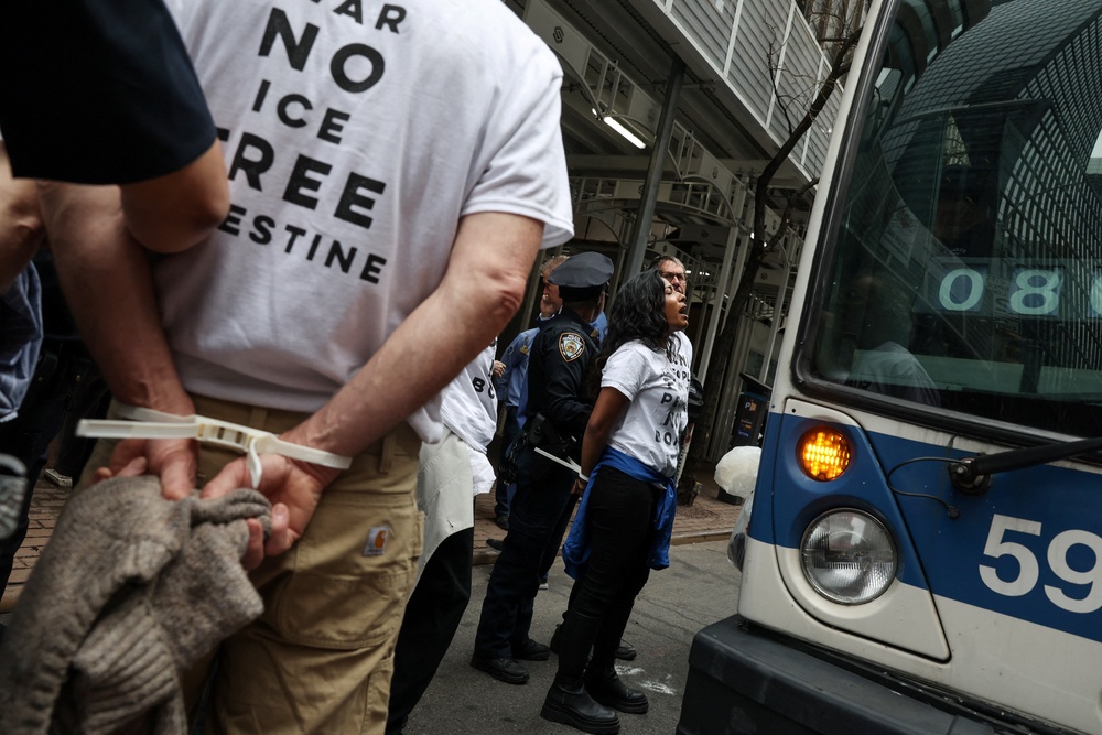 NYPD officers detain a demonstrator during a protest (REUTERS)