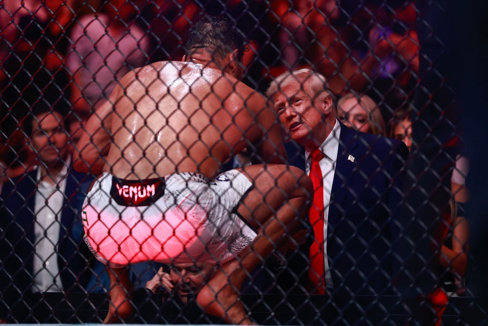 'You could be a model, you look so good,' Trump told Brazilian fighter Paulo Costa after his victory on Saturday (Getty Images)