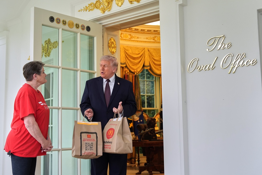 Donald Trump accepted a McDonald’s delivery before holding an impromptu press conference outside the Oval Office (AP Photo/Alex Brandon) (AP)