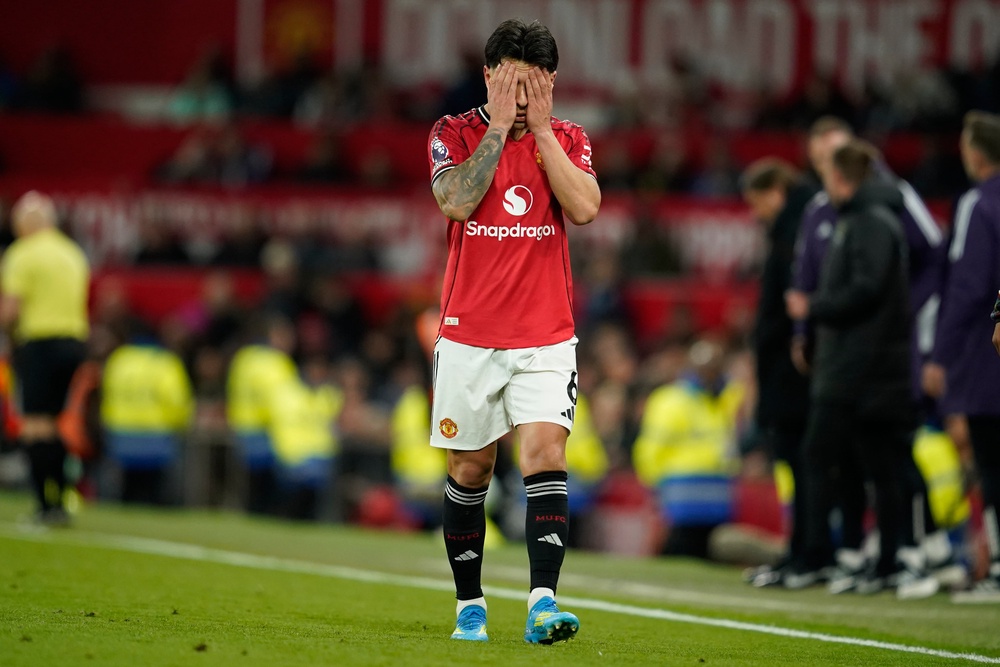 Lisandro Martinez heads down the tunnel after being sent off against Leeds (AP)