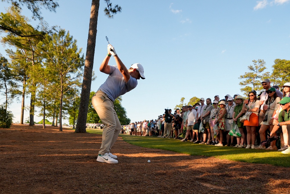 Not for the first time, McIlroy’s driving put him out of position heading down the 18th with a two-shot lead (AP)