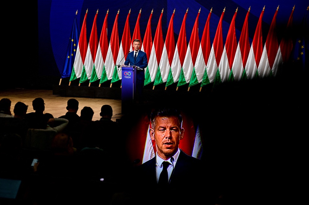 Peter Magyar, leader of the opposition Tisza Party, is seen throught a camera's viewfinder while speaking during a press conference (Reuters)