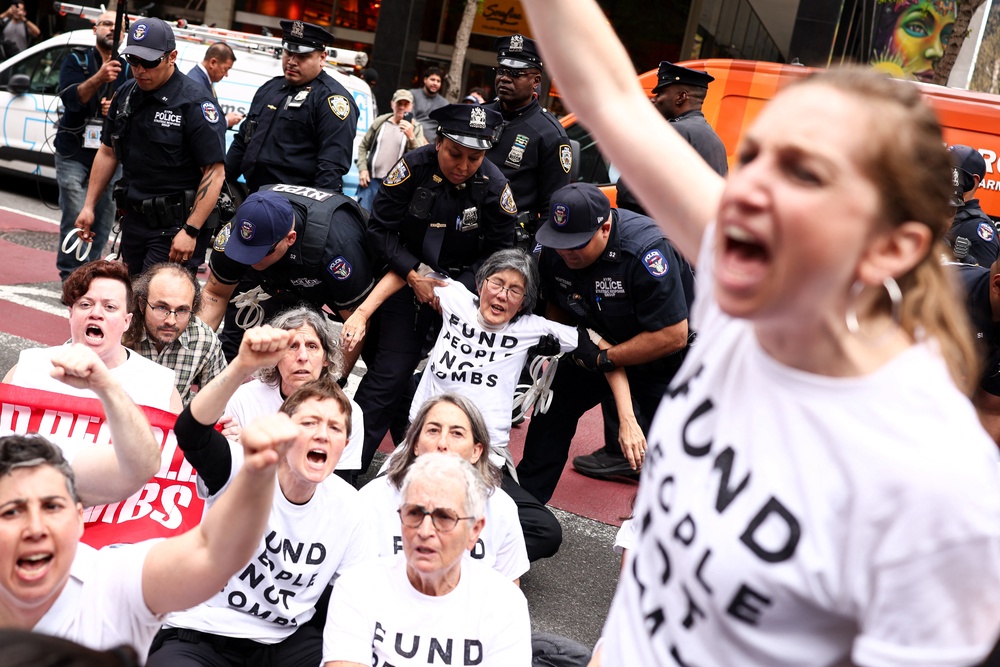 Protesters are arrested by police during a demonstration and sit-in on Third Avenue in New York City on April 13, 2026 (AFP/Getty)